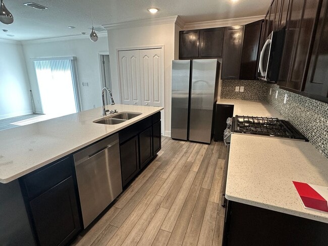 Building Photo - Nearly New 3 Bedroom Smart Home with Lawn Care Included!