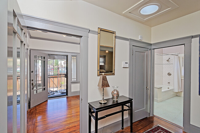 hallway view showing entryway on left, bathroom to the right. Solar tube allows natural light. - 2835 Georgia St