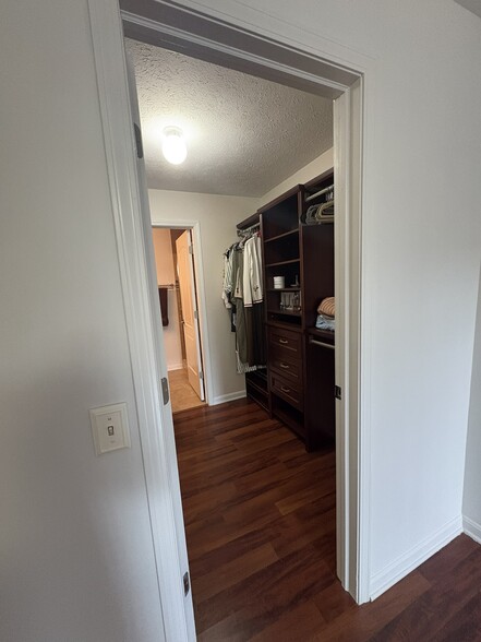 Primary walk-in closet - 8615 Scenicview Dr