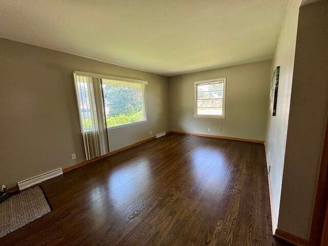 Living Room Featuring newly refinished hardwood floors - 2670 N 116th St
