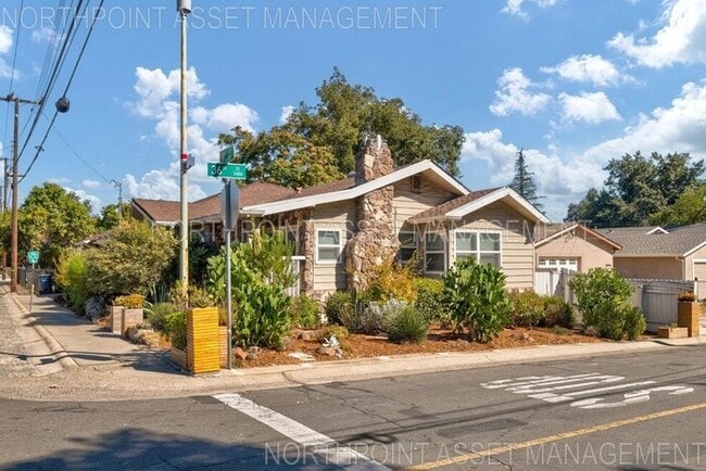 Building Photo - Welcome to this stunning 4-bedroom, 2-bath...