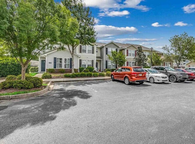 Building Photo - Relax and Unwind in this Spacious End-Unit...
