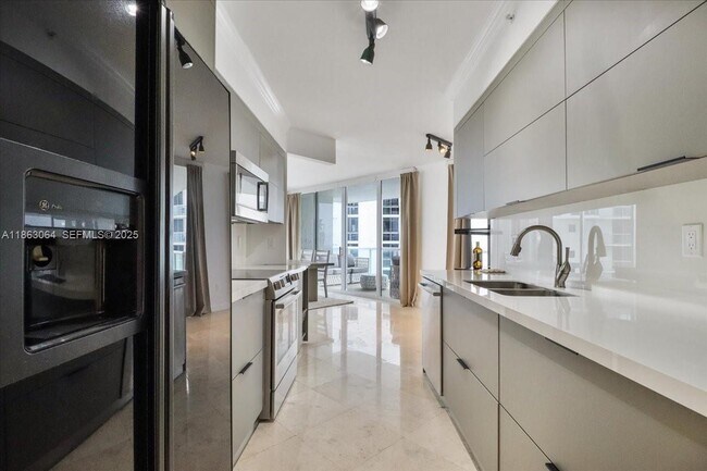 Building Photo - 18671 Collins Ave