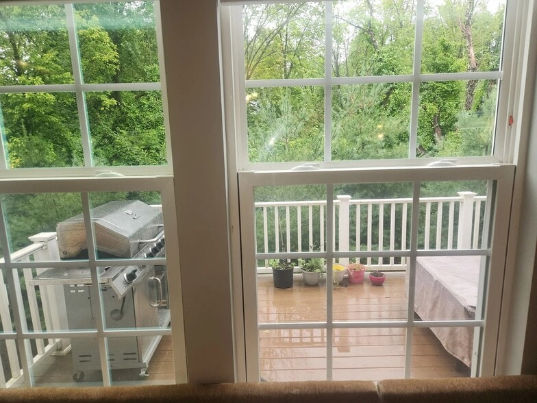 Elevated deck off the main living area for outdoor dining and relaxation. - 1736 Beacon Ln