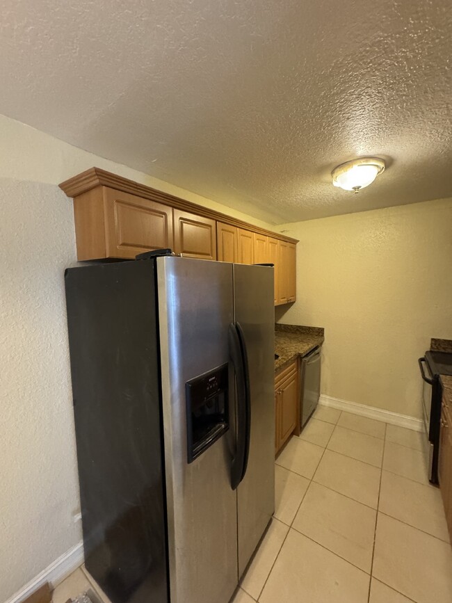 Building Photo - "Charming 1-Bedroom Condo Retreat with Stu...