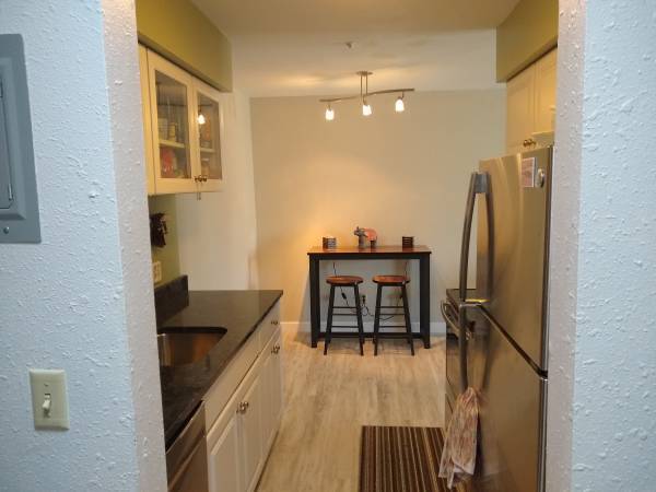 Brand new luxury vinyl flooring and granite counter tops! - 7414 W 22nd St