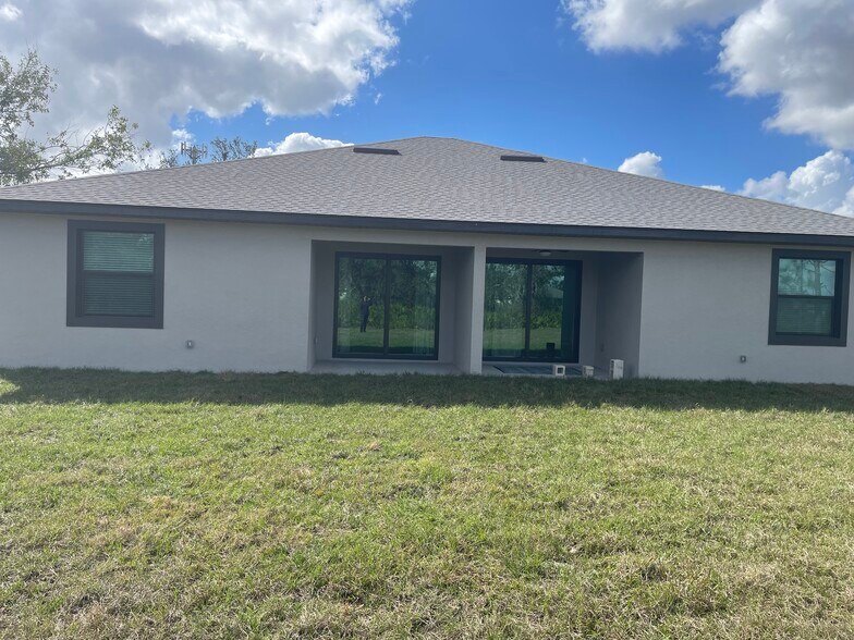 Rear property with outdoor lanai - 26382 Explorer Rd