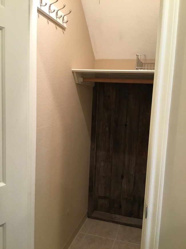 Under stairs closet with shelf, jacket hooks, clothes rod and pull out metal drawer rack - 1103 Dulles Ave