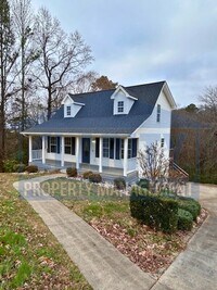 Building Photo - Three bedroom with attached garage!