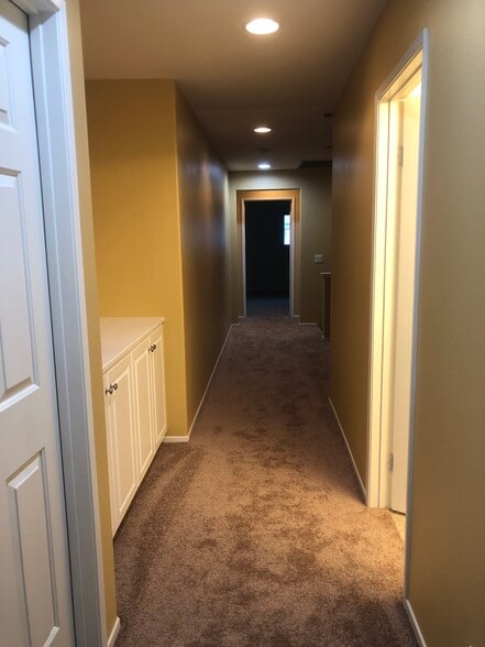 Hallway area with full bath near bedrooms. - 6395 Delgado Ln