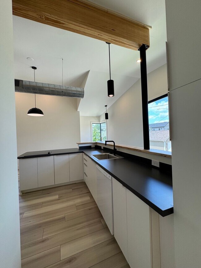 Building Photo - Vaulted Ceilings & Hardwood Floors in This Charming Indianapolis L