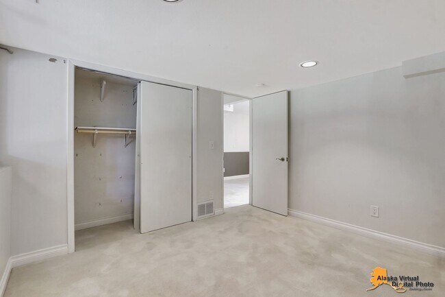 Building Photo - Eagle River Home w/ Fenced Yard, Sunroom, and Garage!