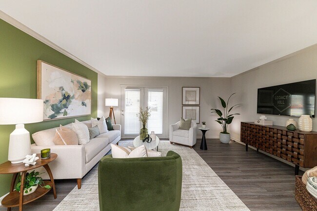 Spacious living room with hardwood-style flooring - Vetra Belle Meade