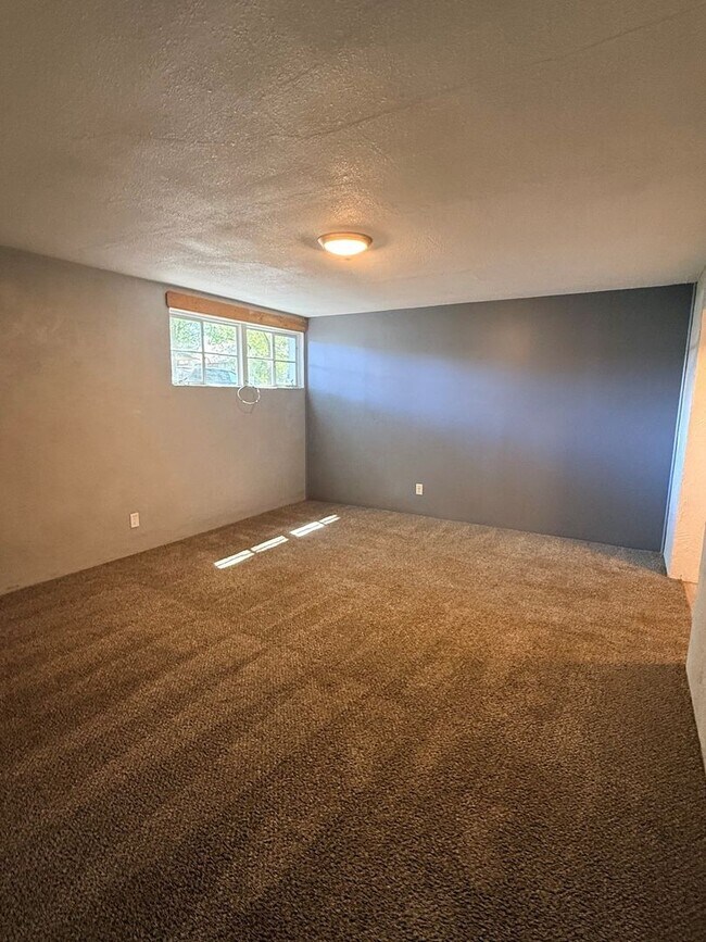 Building Photo - Bright & Spacious 2-Bed Basement Gem w/Garage Access