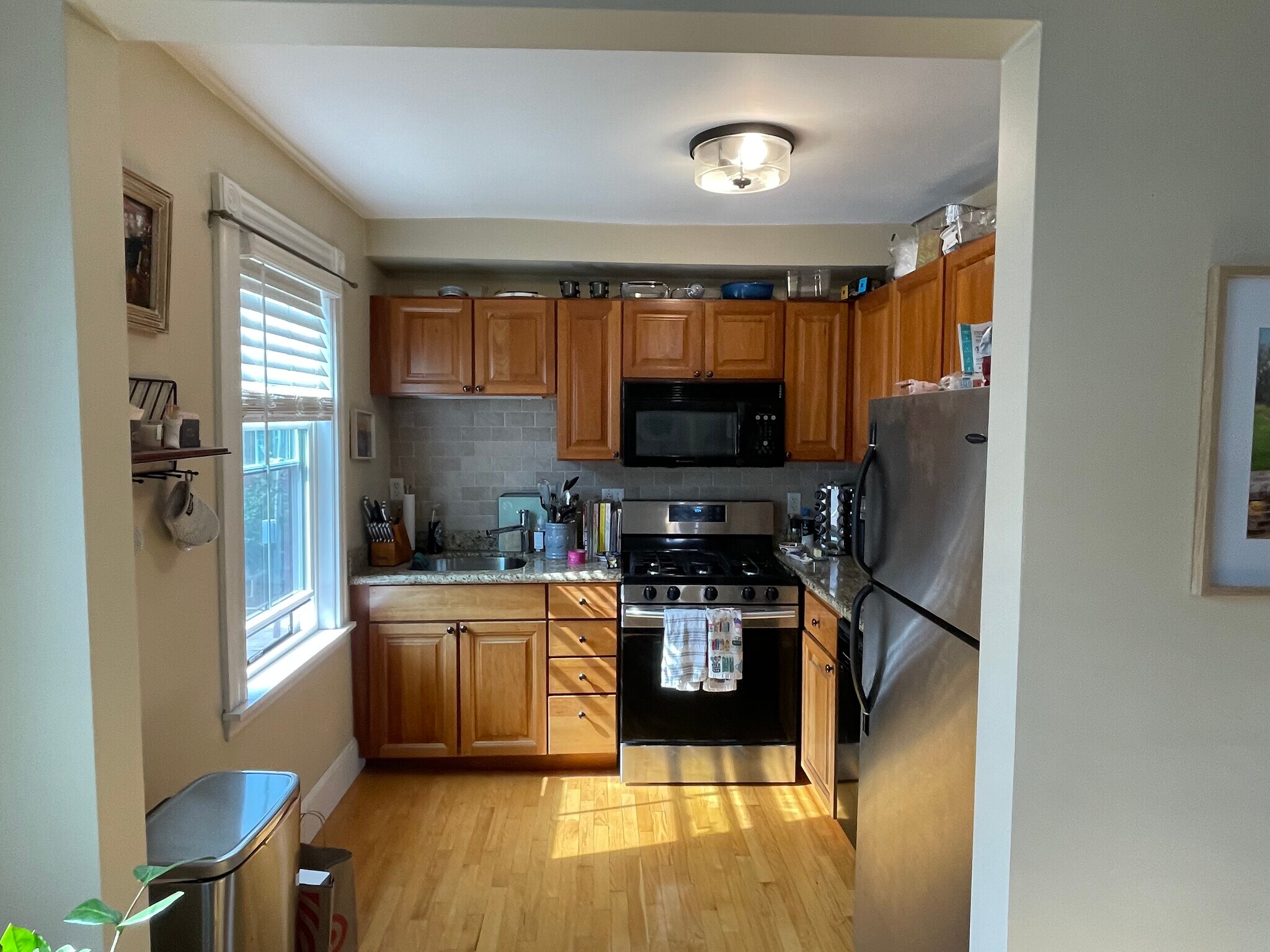 Bright kitchen with a full sized oven, dishwasher, fridge and garbage disposal. - 34 F St