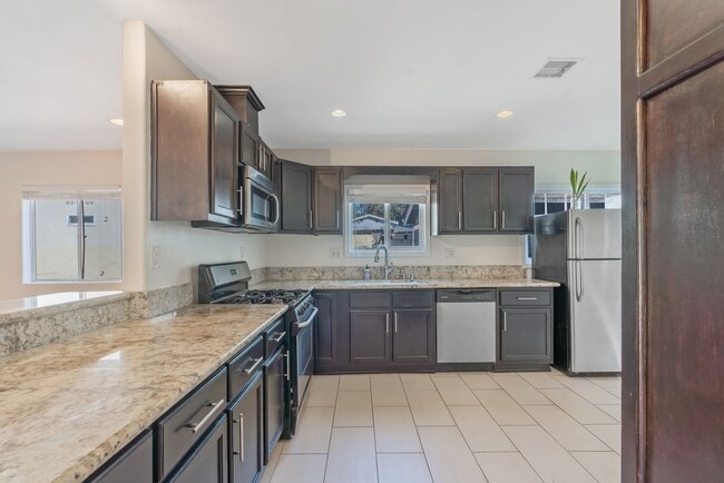 Building Photo - Stylish 2-Bedroom Retreat with Private Yar...