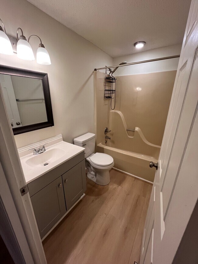 Full bath upstairs with new luxury vinyl flooring - 9908 Whitney Cir