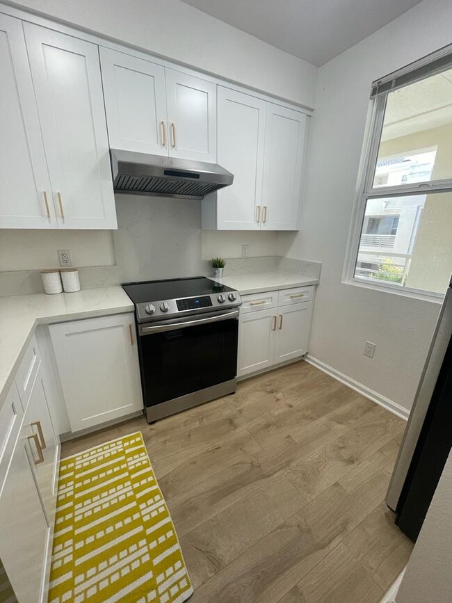 Remodeled kitchen with plenty of counter space and cabinets - 1 Crescent Way