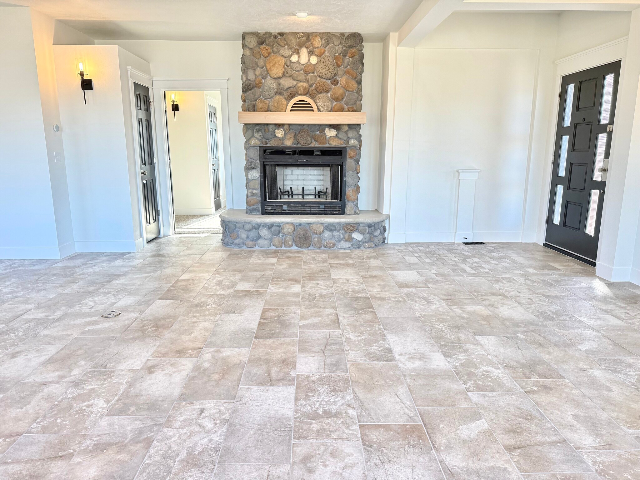 Stone fireplace - not operational, bedroom to the left, storage closet door to the left - 24 Ash St N