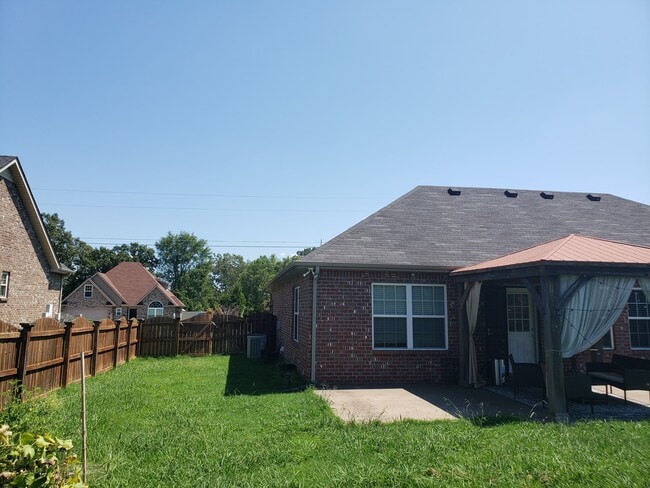 Area already cleared for small backyard garden. - 820 Laramie Ct