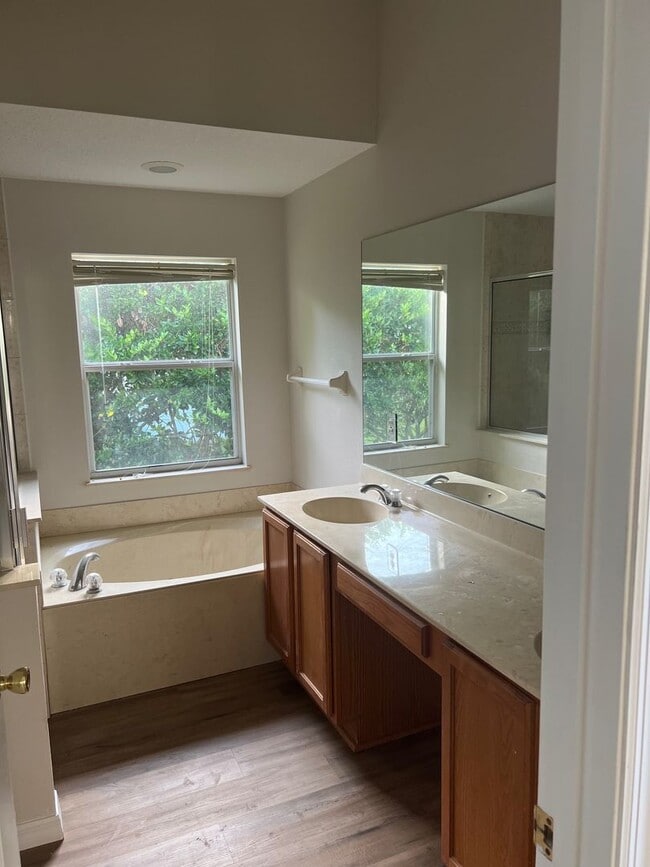 Building Photo - Water view 4/2 home in gated Spring Glen Community-Move-In Ready- 2 Car Garage- Debary!