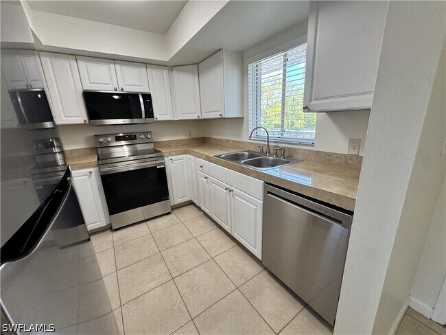 Building Photo - 12250 Tamiami Trl E
