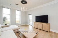 Building Photo - Waterfront Oasis: Fully Furnished 1BR/1.5BA with Marsh Views