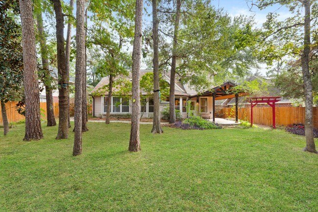 Building Photo - The Perfect Woodlands Retreat: Steps from ...