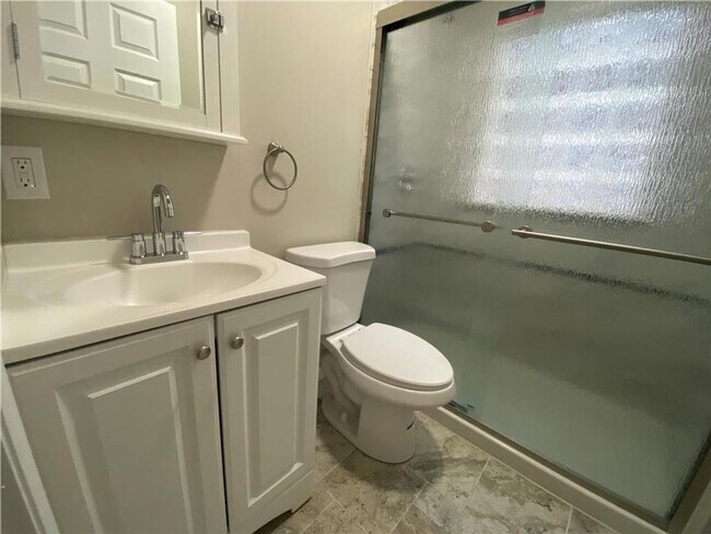 Building Photo - Charming three-bedroom row house available...