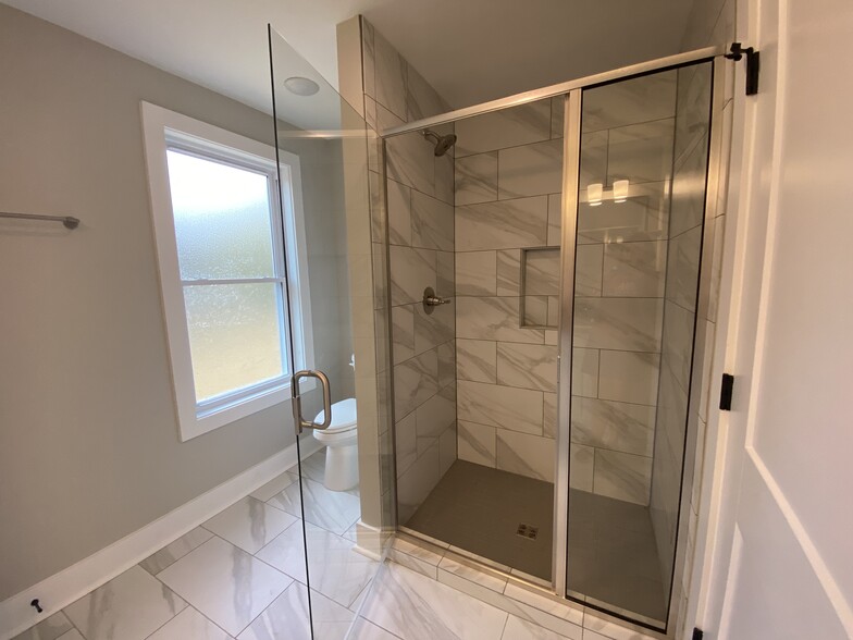 Luxury tile and glass shower in brand new renovation - 1524 Ward Ave NE