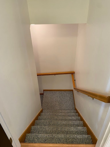 Stairway going downstairs. - 9 Daytona Beach Dr