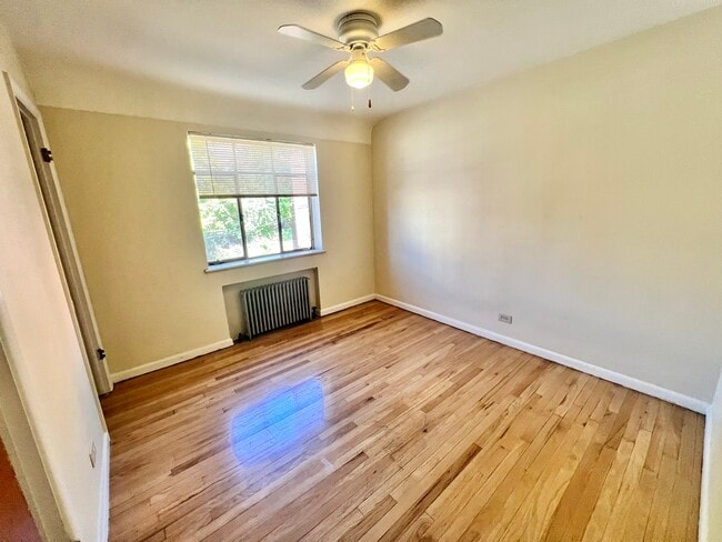 Step into this inviting bedroom, bathed in natural light for a cheerful ambiance. - Hillside Apartments