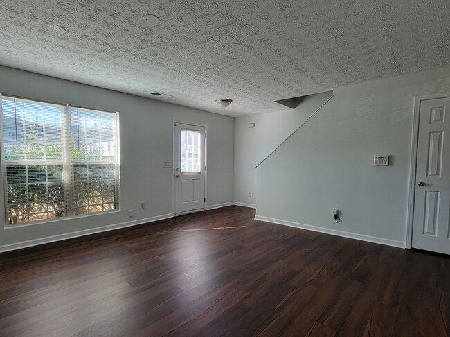 Building Photo - Experience modern living in this stunning two-story townhome! Awesome School District