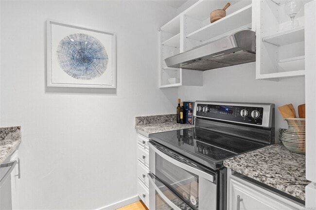 Stainless steel stove with hood - 730 Bellevue Ave E