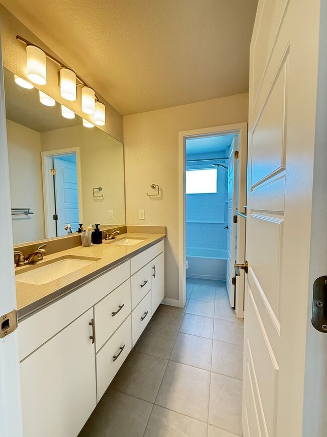 Building Photo - Stunning Luxury Living in Coal Creek with ...