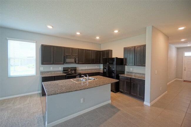 Building Photo - 6911 Breezy Palm Dr