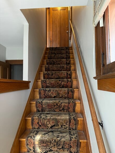 Entry way looking up stairs to apartment - 40 W Tompkins St