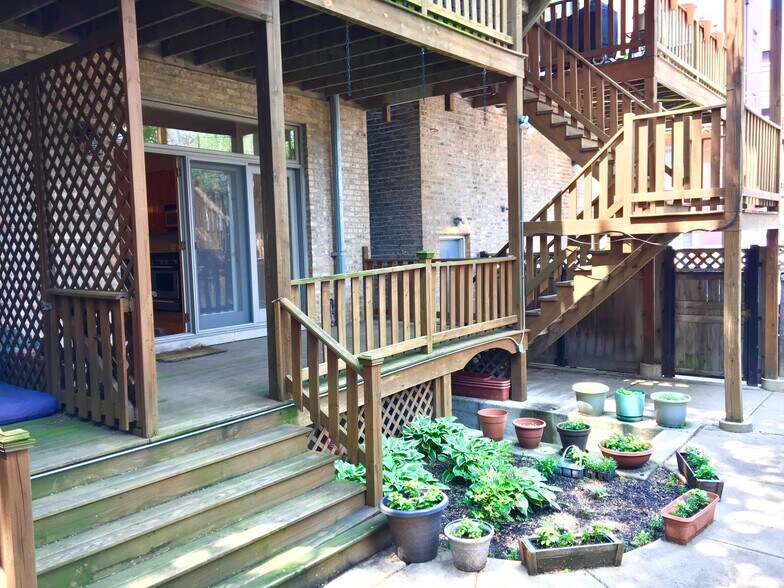 Shared garden space parking spot behind fence - 743 N Wolcott Ave