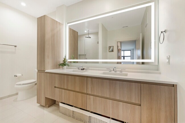 Primary bathroom with dual vanity - 701 Swann Ave