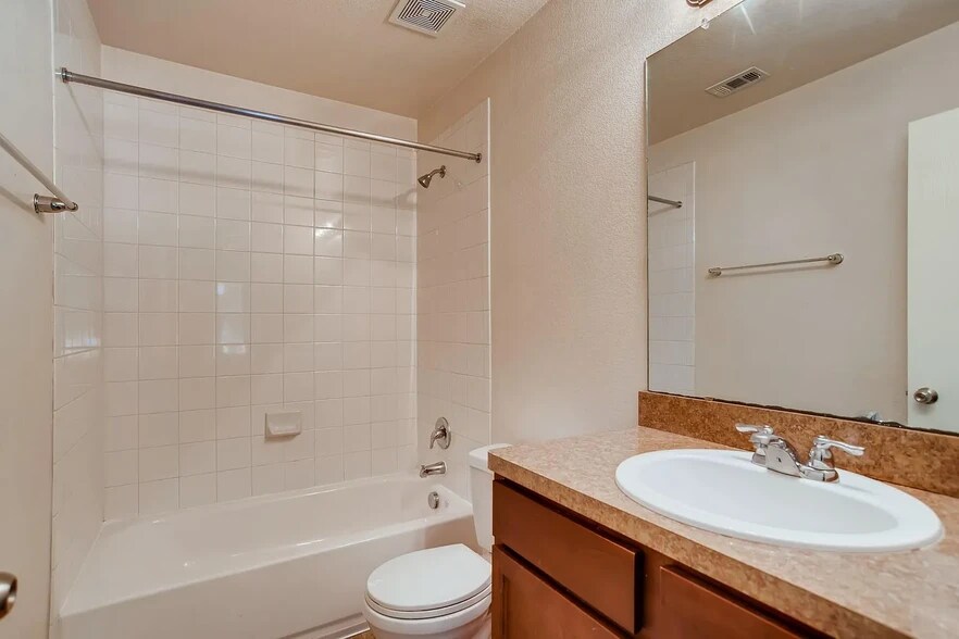 Full bathroom with a bathtub - 15106 Parrish Ln