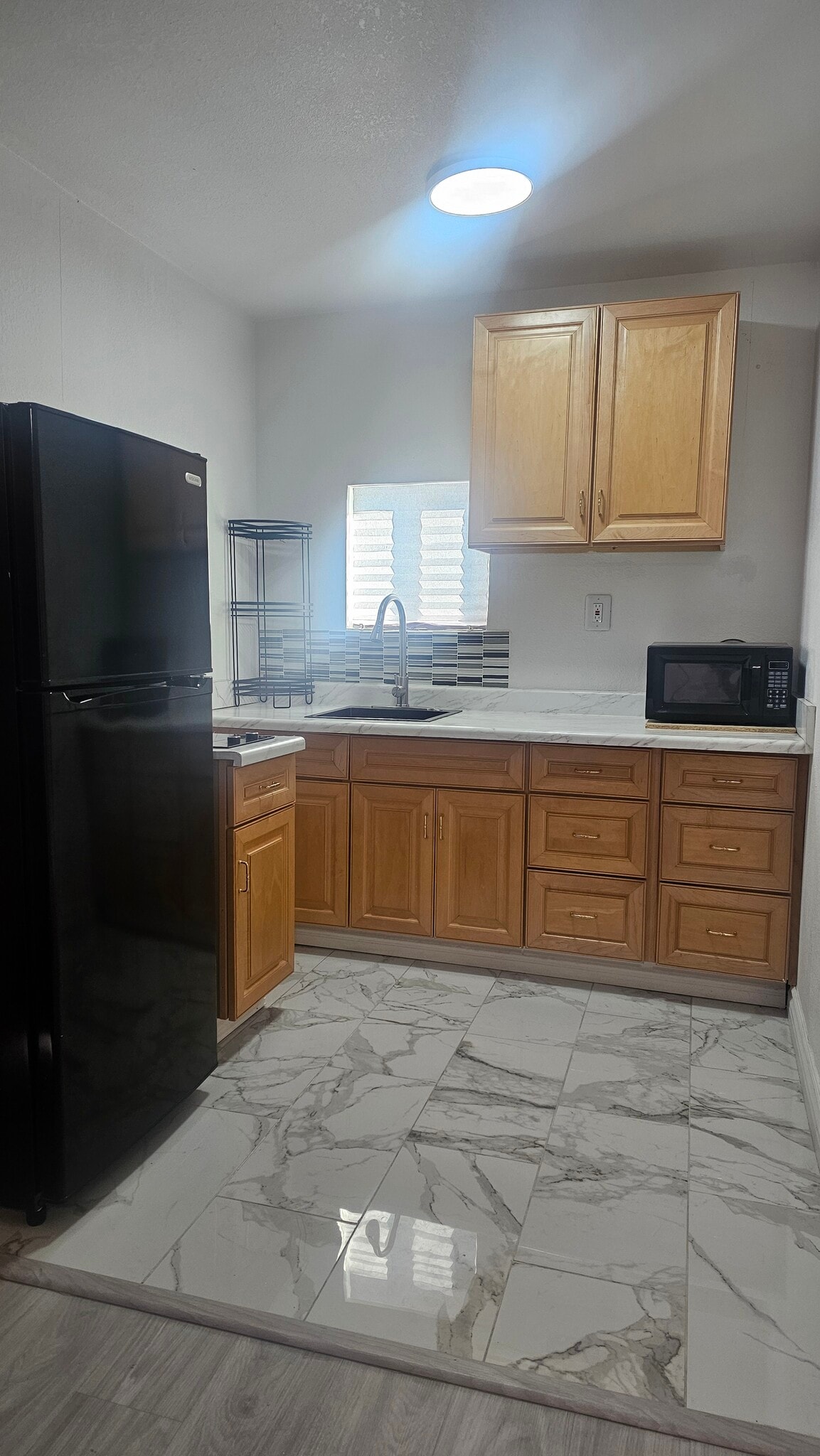 kitchen with microwave, refrigerator and electric stove - 2229 Goldhill Way
