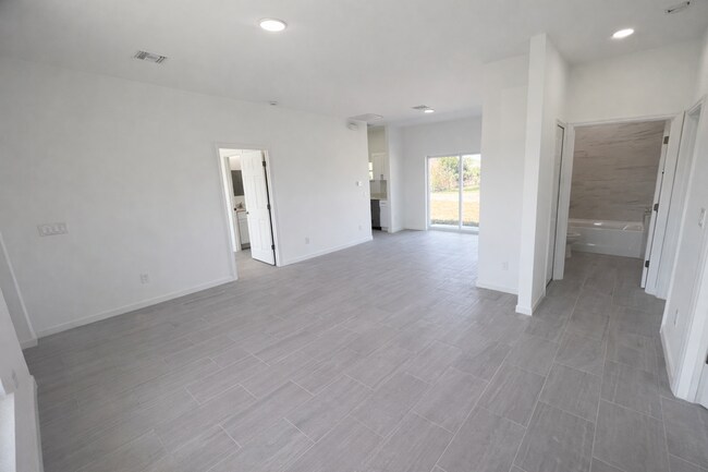 Building Photo - BRAND NEW MODERN SF HOME 3BD+den/2BA with GARAGE IN LEHIGH ACRES!