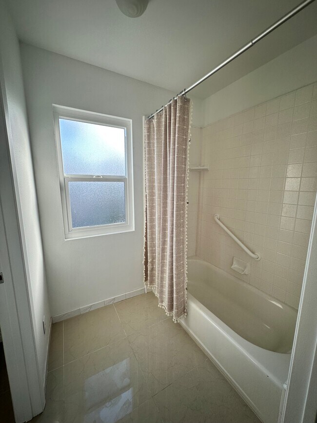 Upstairs tub and shower - 4162 W 167th St