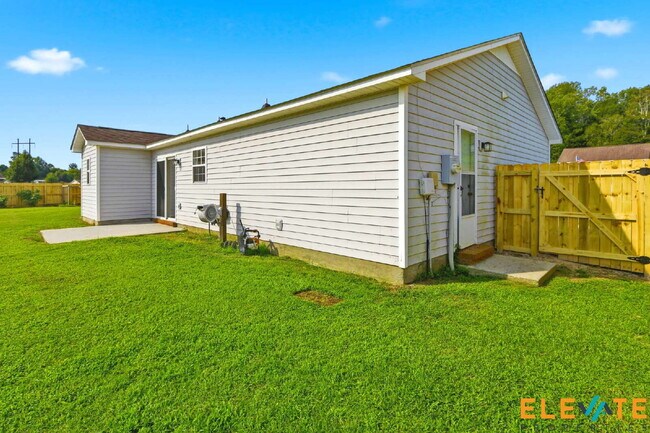 Building Photo - Beautiful Like-New 3 Bedroom Home with Huge Fenced Yard, Greenhouse & Storage