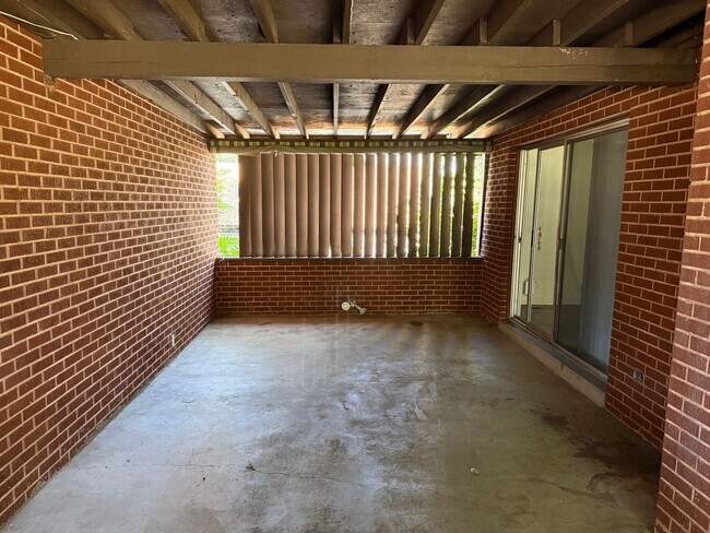 Building Photo - Beautiful town home with central air, deep 2 car garage and a large covered patio