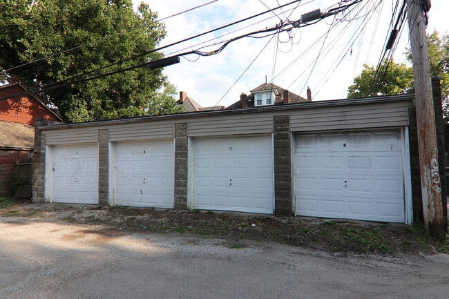 View four garages that belong to the house equipped with remote door openers - 372 E Oakland Ave