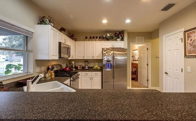 Building Photo - Charming 4-Bedroom Home with Pond Views & ...