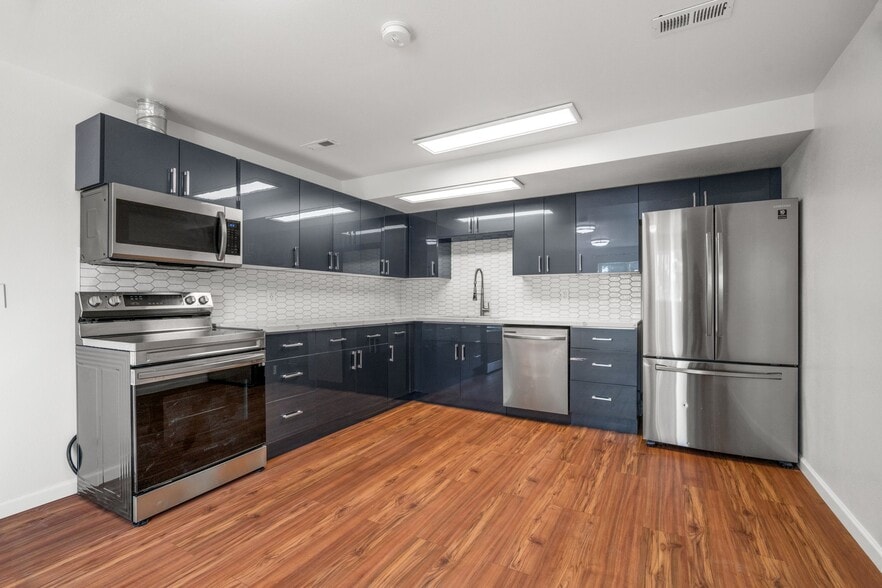 Open concept modern renovated high-end kitchen with all new stainless steel appliances - 411 124th St S