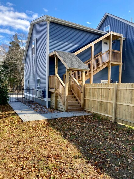 Covered stairs to the apartment. - 22 Denmore Ln