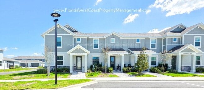 Building Photo - EXCEPTIONAL AND SPACIOUS FURNISHED TOWNHOME WITHIN WATERSIDE- NAUTIQUE!